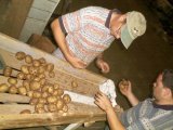 William and Dennis Check Out a Bag of Potatoes